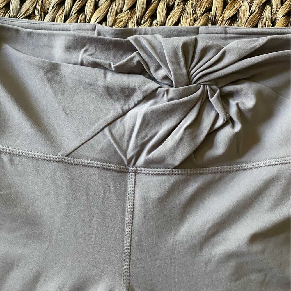 Lavender Lululemon leggings with twist front
